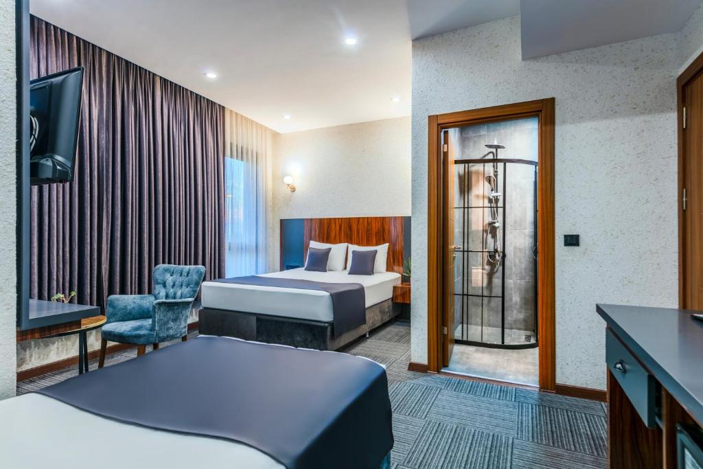 Postel nebo postele na pokoji v ubytování MED Airport Hotel