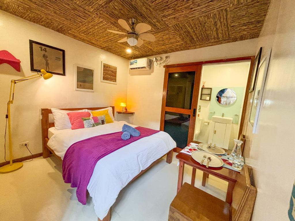 Postel nebo postele na pokoji v ubytování Copacabana Siargao