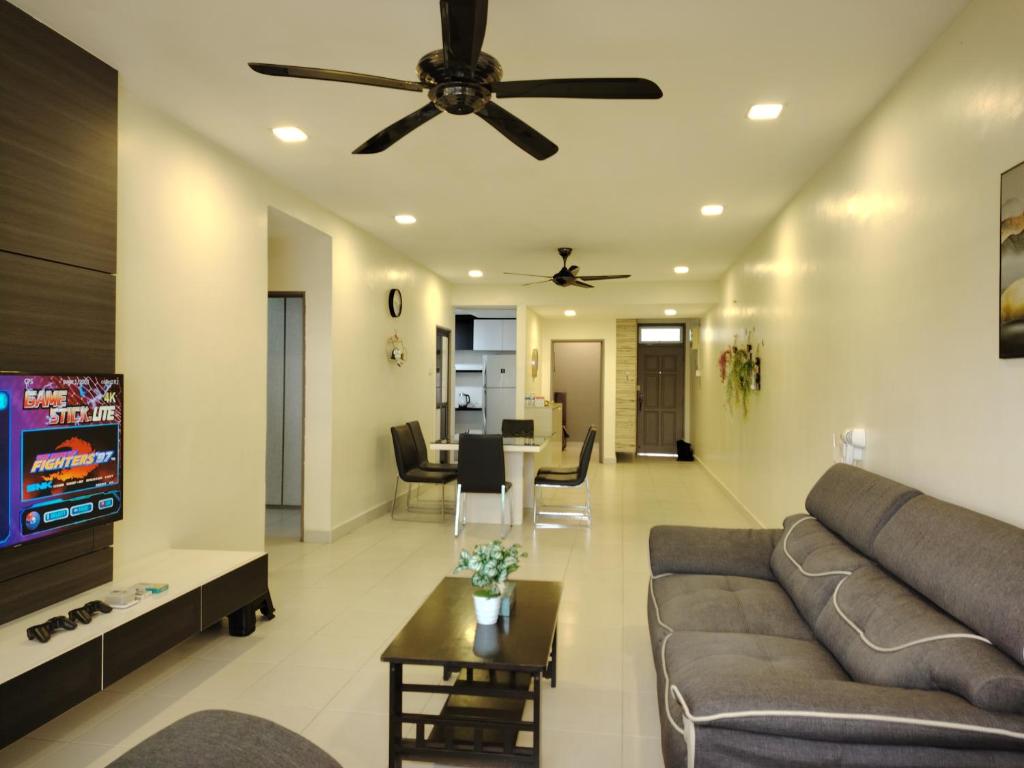 a living room with a couch and a ceiling fan at MGM-Tebrau City Walk within 5 min to AEON Mall, Ikea & Toppen in Johor Bahru