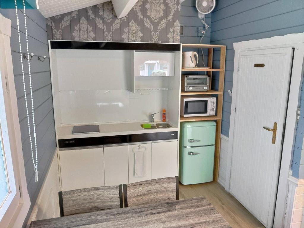 Kuchyň nebo kuchyňský kout v ubytování Cottage Morinokokage