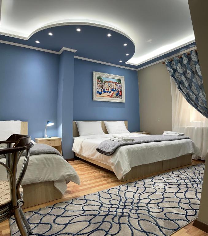 Postel nebo postele na pokoji v ubytování Vila A Hotel