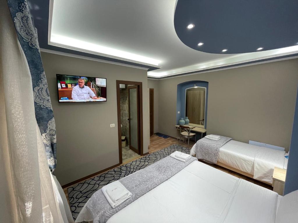 Postel nebo postele na pokoji v ubytování Vila A Hotel
