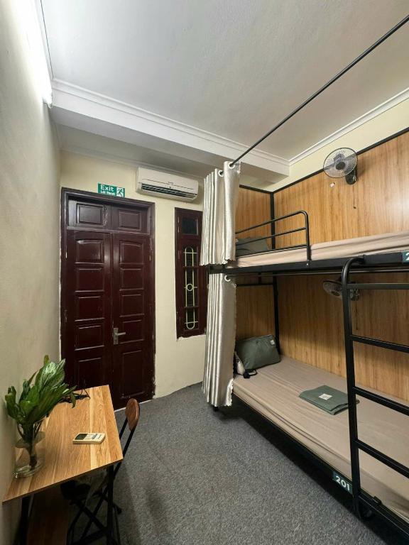 Postel nebo postele na pokoji v ubytování Dreamer Dormitory