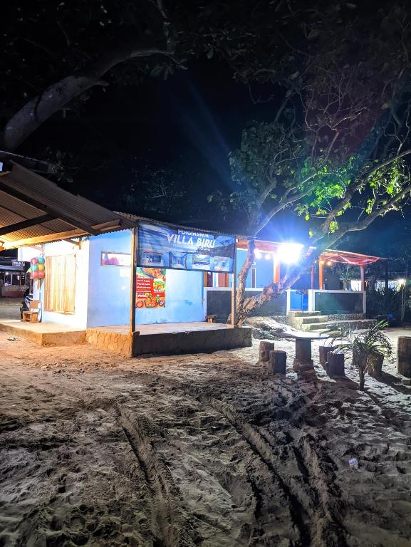 a gas station at night with the lights on at VILLA BIRU PANTAI GOA LANGIR Sawarna in Sawarna