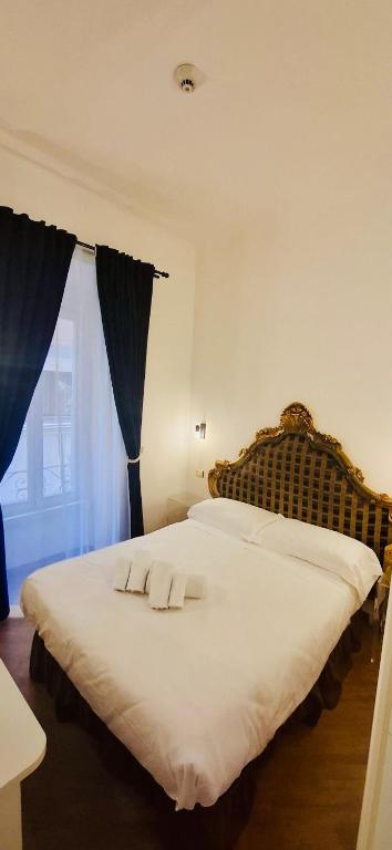Postel nebo postele na pokoji v ubytování DCBoutiqueHotel