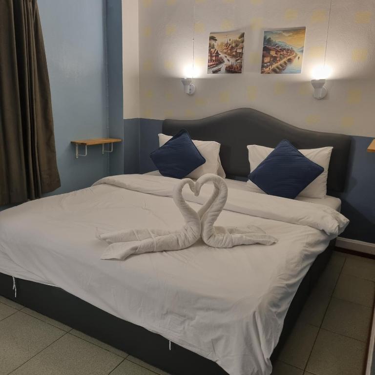 Postel nebo postele na pokoji v ubytování Sams ChiangKhan