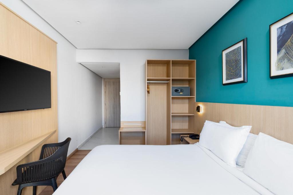 Postel nebo postele na pokoji v ubytování Rihab Hotel