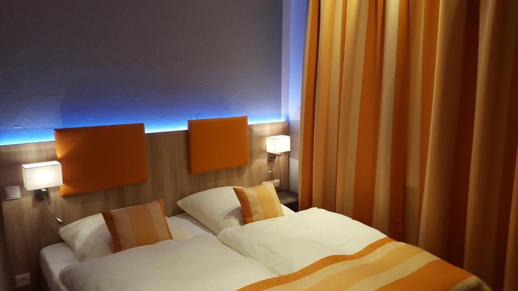 Ένα ή περισσότερα κρεβάτια σε δωμάτιο στο Hotel Trutzpfaff