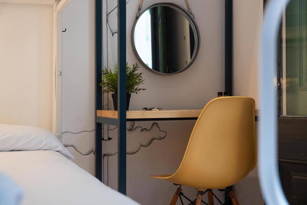Cama ou camas em um quarto em The Central House Barcelona Gracia