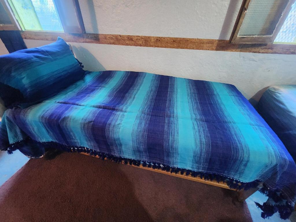Postel nebo postele na pokoji v ubytování Gîte de montagne Azilane