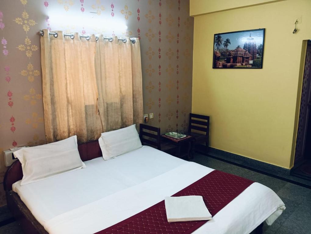 Postel nebo postele na pokoji v ubytování Hotel Swagat
