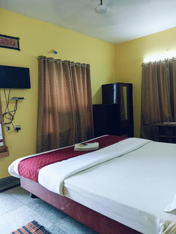 Postel nebo postele na pokoji v ubytování Hotel Swagat