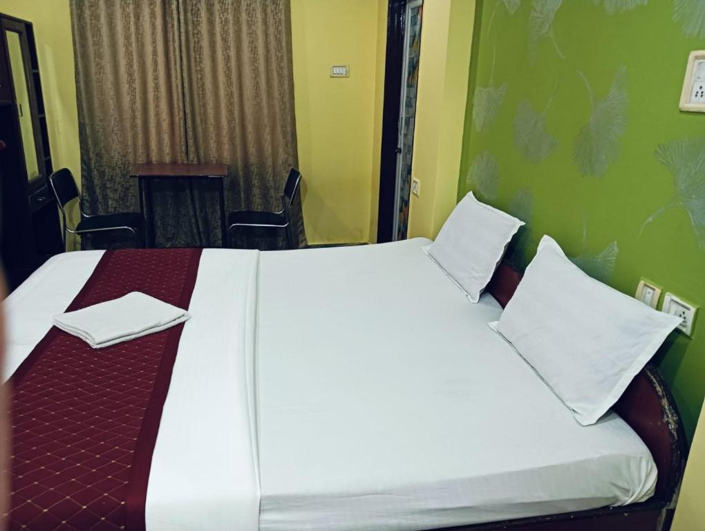 Postel nebo postele na pokoji v ubytování Hotel Swagat
