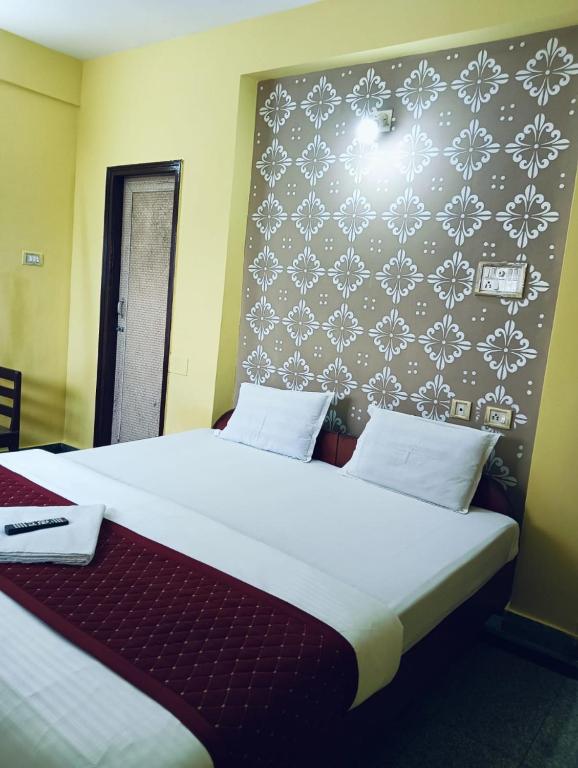 Postel nebo postele na pokoji v ubytování Hotel Swagat