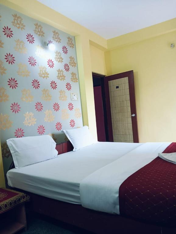 Postel nebo postele na pokoji v ubytování Hotel Swagat