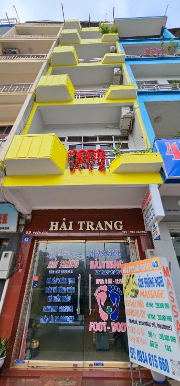 a building with a hican trends sign on the front of it at Hai Trang Hotel in Ha Long