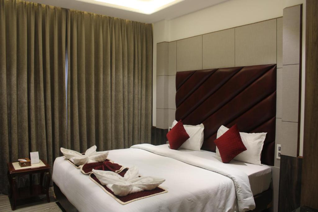 Postel nebo postele na pokoji v ubytování Hotel k11
