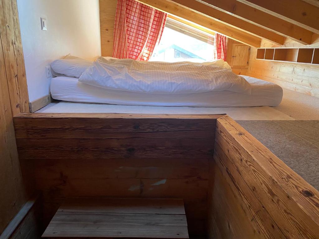Postel nebo postele na pokoji v ubytování Verbier Valmont in center