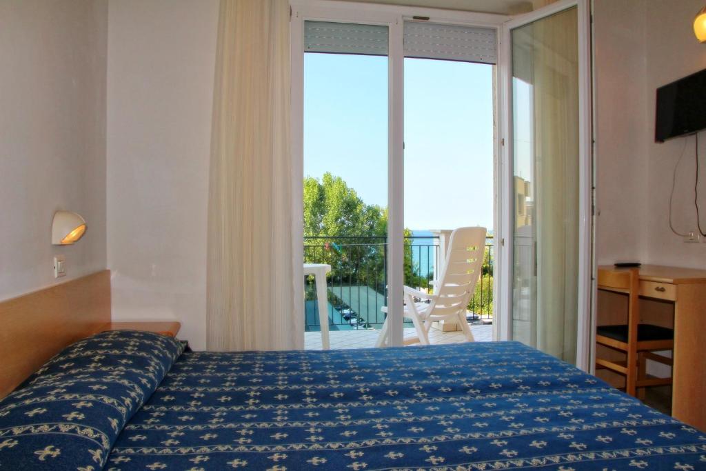 Postel nebo postele na pokoji v ubytování Sporting hotel