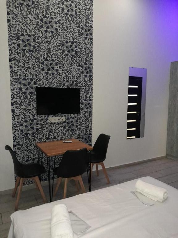 TV a/nebo společenská místnost v ubytování Amiryan by Armani hotels collection