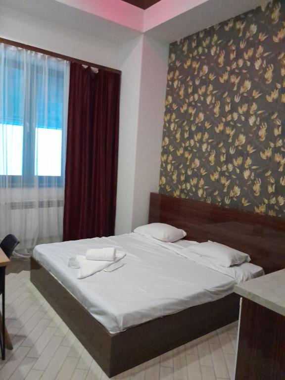 Postel nebo postele na pokoji v ubytování Amiryan by Armani hotels collection