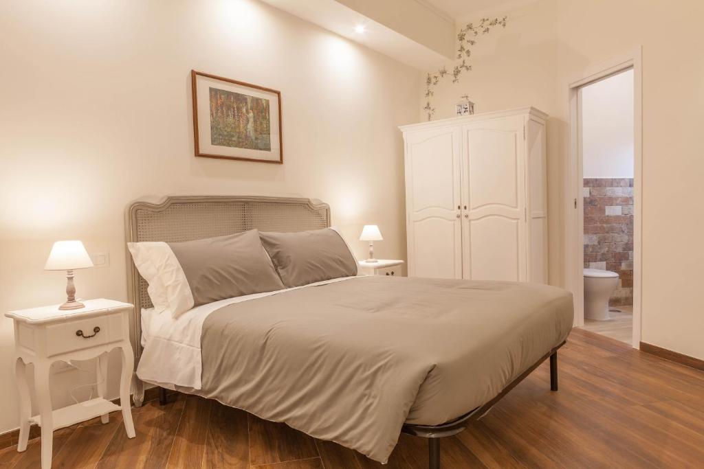 Posteľ alebo postele v izbe v ubytovaní Donna Margherita Rome Suite & Rooms
