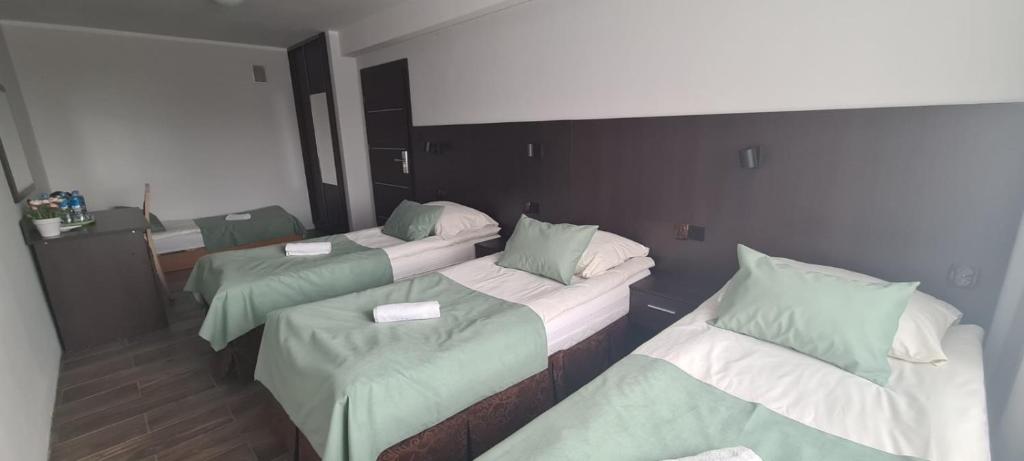 Posteľ alebo postele v izbe v ubytovaní SELMENT RESORT Mazury