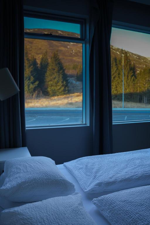 Postel nebo postele na pokoji v ubytování Hótel Laugarvatn