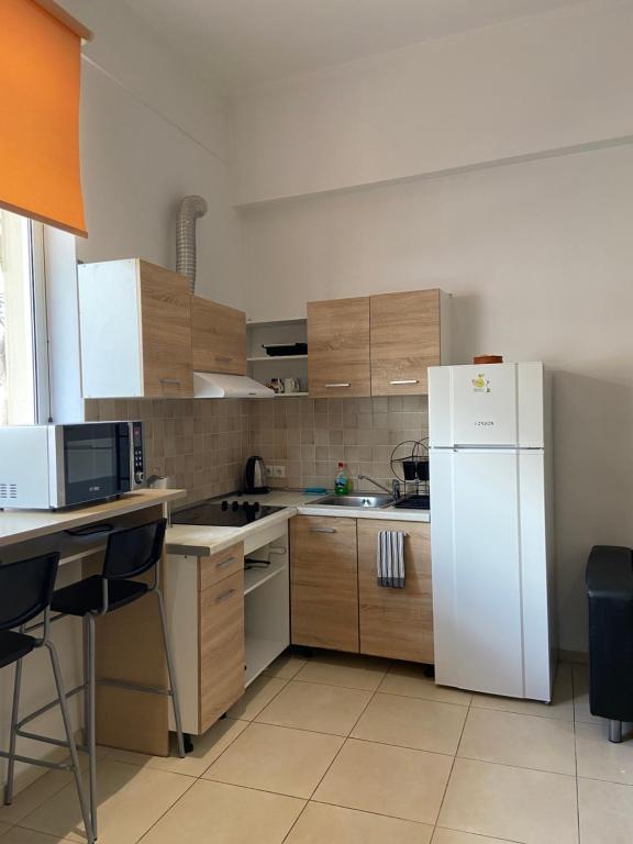 Kuchyň nebo kuchyňský kout v ubytování Sisifou Hostel
