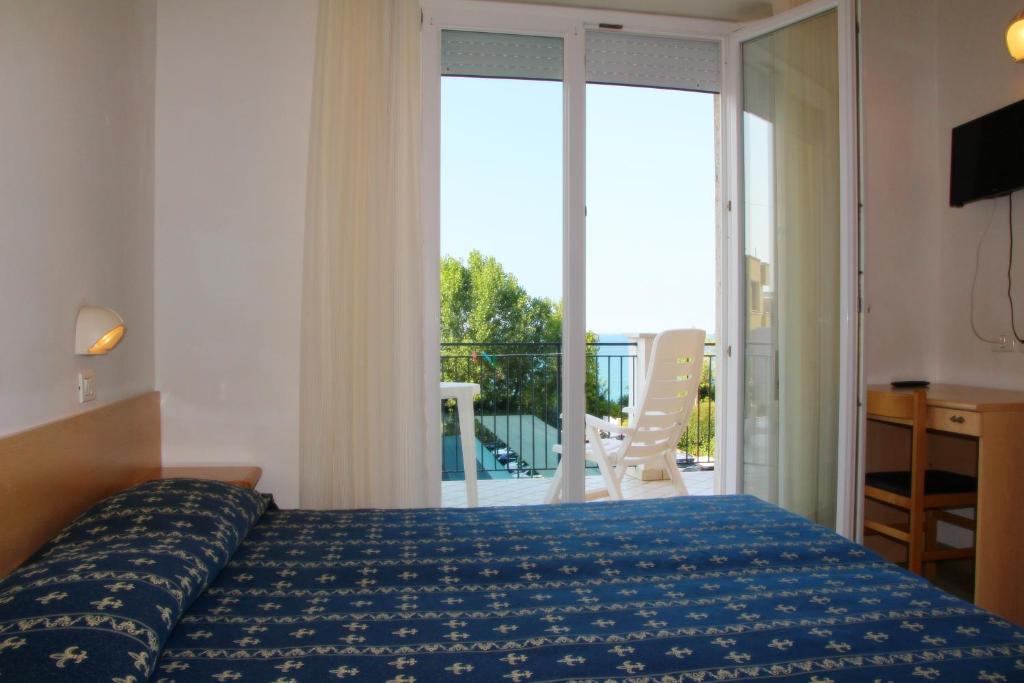 Postel nebo postele na pokoji v ubytování Sporting hotel