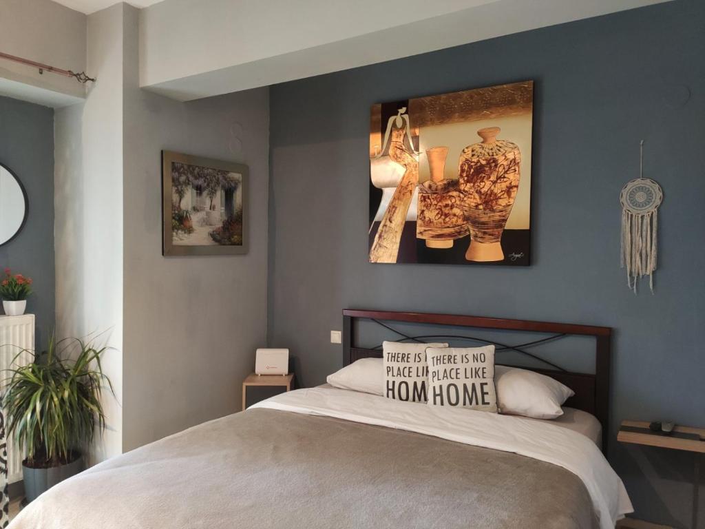 A bed or beds in a room at Prosilio Apartment