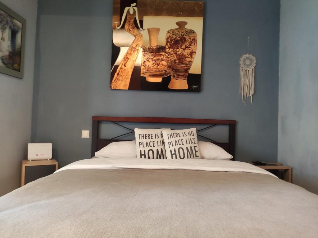 A bed or beds in a room at Prosilio Apartment
