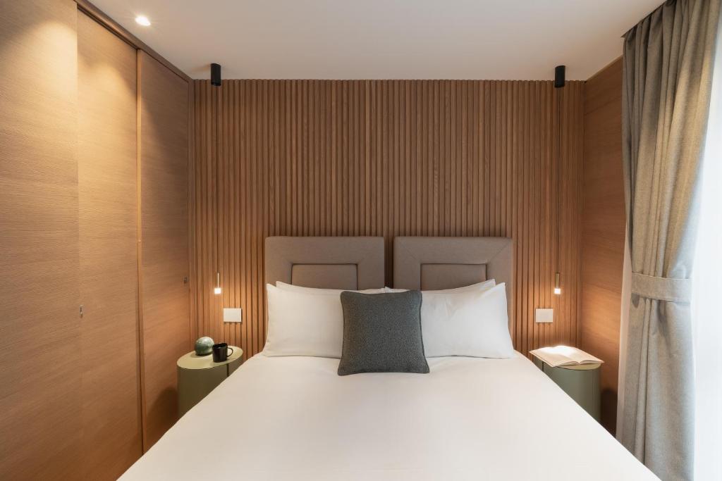 A bed or beds in a room at Campiglio WOOD
