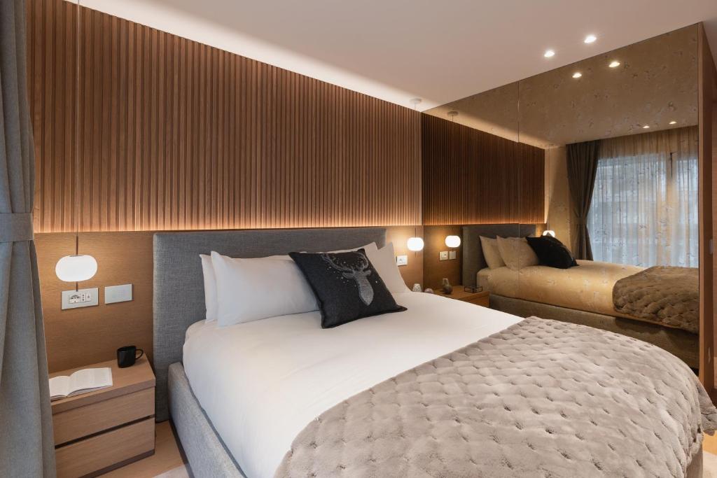 A bed or beds in a room at Campiglio WOOD
