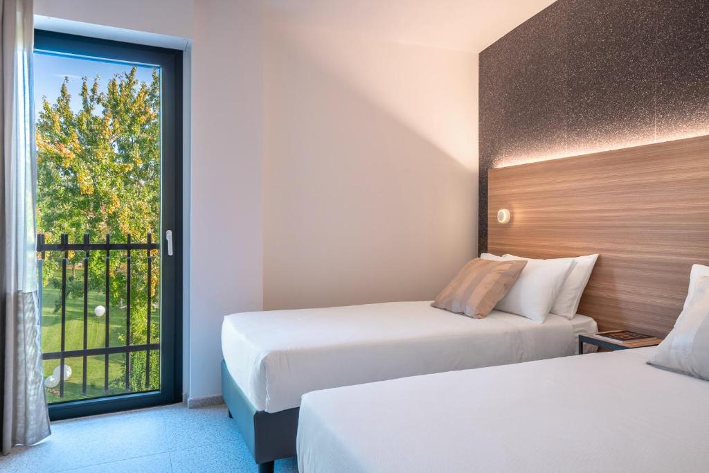 Postel nebo postele na pokoji v ubytování Hub Hotel