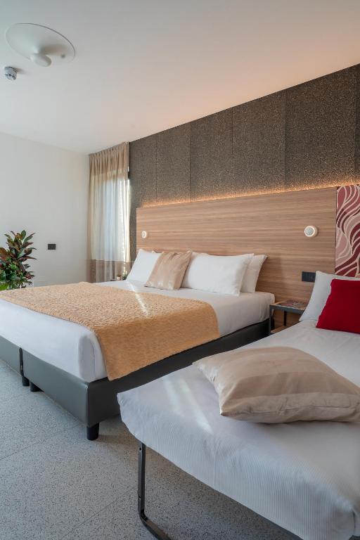 Postel nebo postele na pokoji v ubytování Hub Hotel