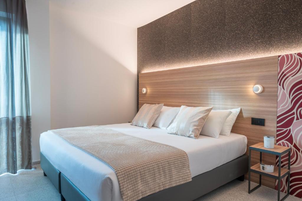 Postel nebo postele na pokoji v ubytování Hub Hotel
