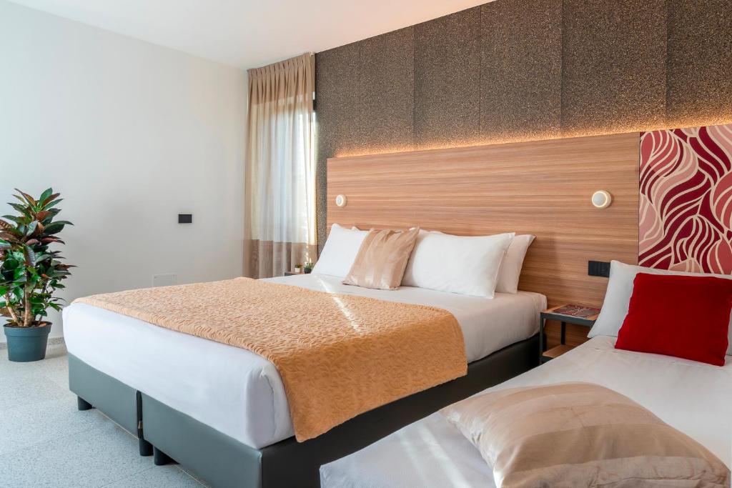 Postel nebo postele na pokoji v ubytování Hub Hotel
