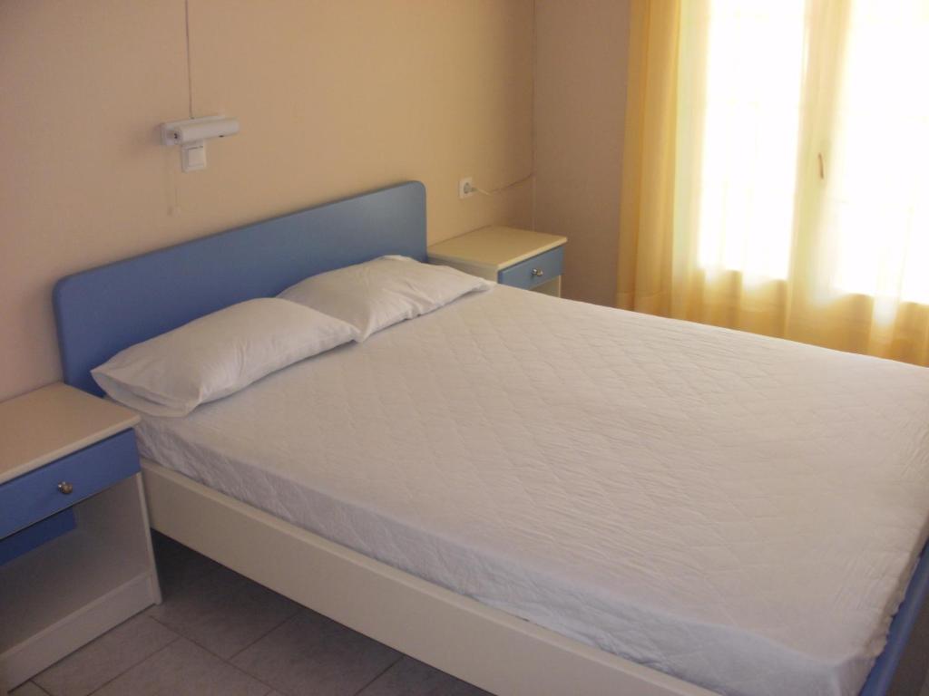 Postel nebo postele na pokoji v ubytování Triantis Apartments