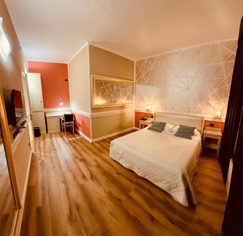 Postel nebo postele na pokoji v ubytování Hotel Malpensa INN Aereoporto