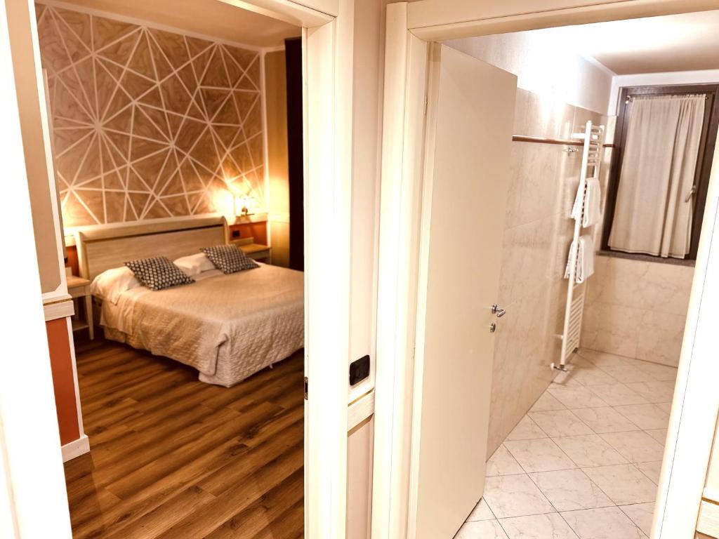 Postel nebo postele na pokoji v ubytování Hotel Malpensa INN Aereoporto