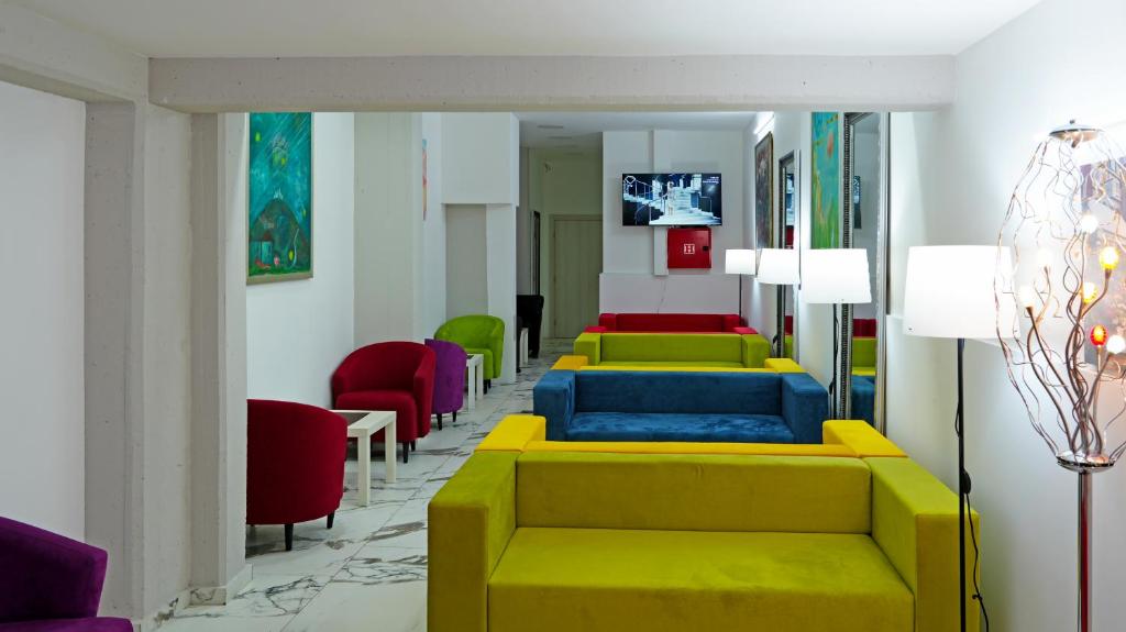 a waiting room with a row of colorful chairs at Apartments Bramar in Zlatibor
