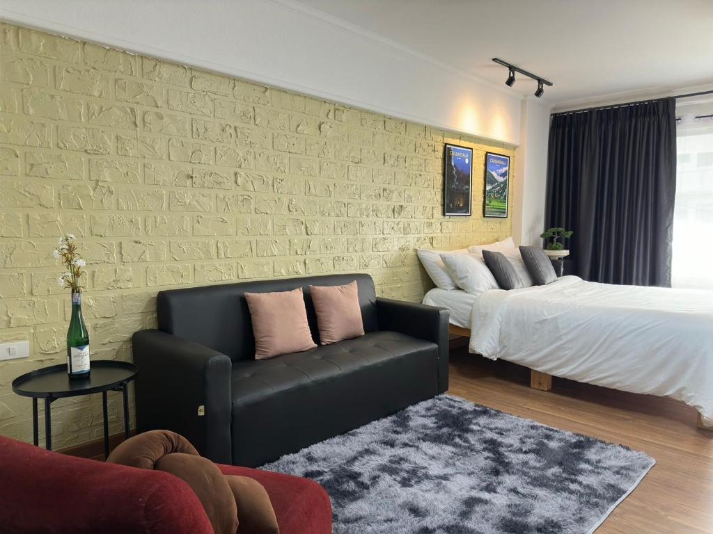 Ένα ή περισσότερα κρεβάτια σε δωμάτιο στο Chiang Mai Charm, Near Nimman