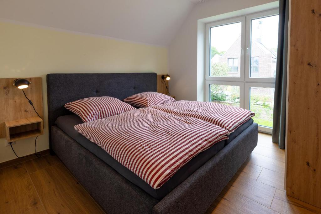 Postel nebo postele na pokoji v ubytování Ferienhaus Strandnest Dangast