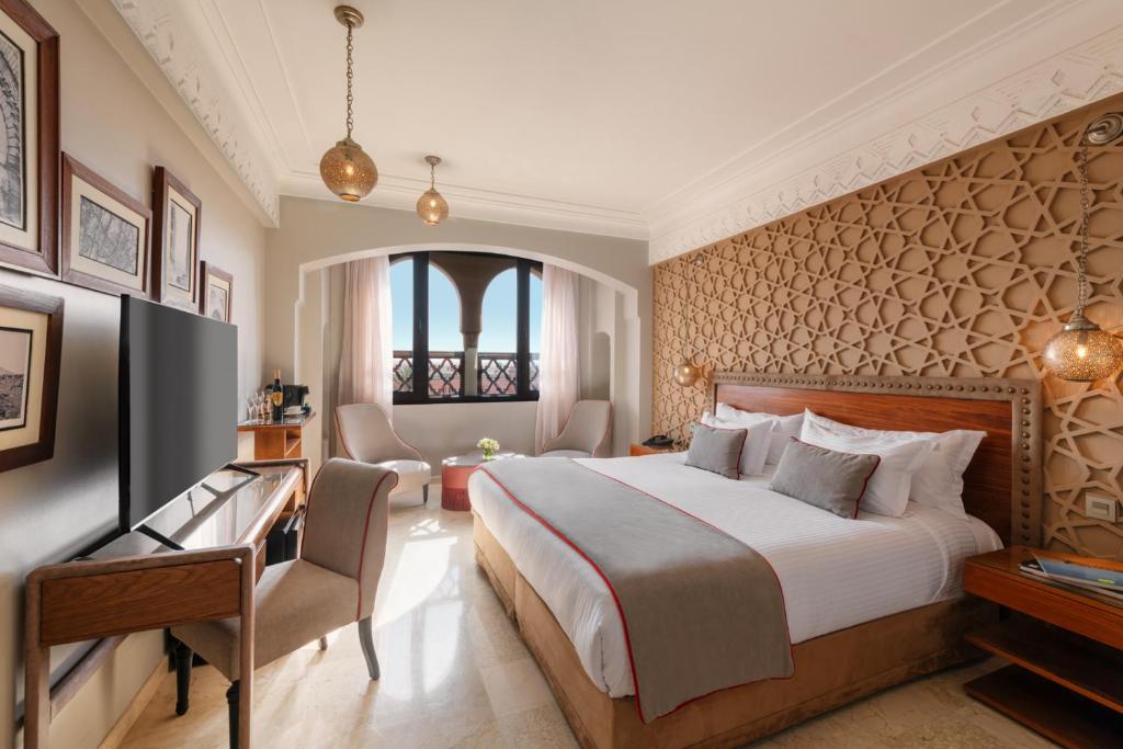 Postel nebo postele na pokoji v ubytování Hivernage Hotel & Spa