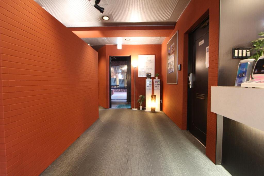 TV a/nebo společenská místnost v ubytování HOTEL LiVEMAX BUDGET Fuchu