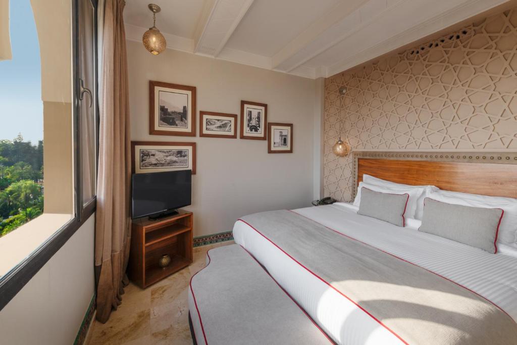 Postel nebo postele na pokoji v ubytování Hivernage Hotel & Spa