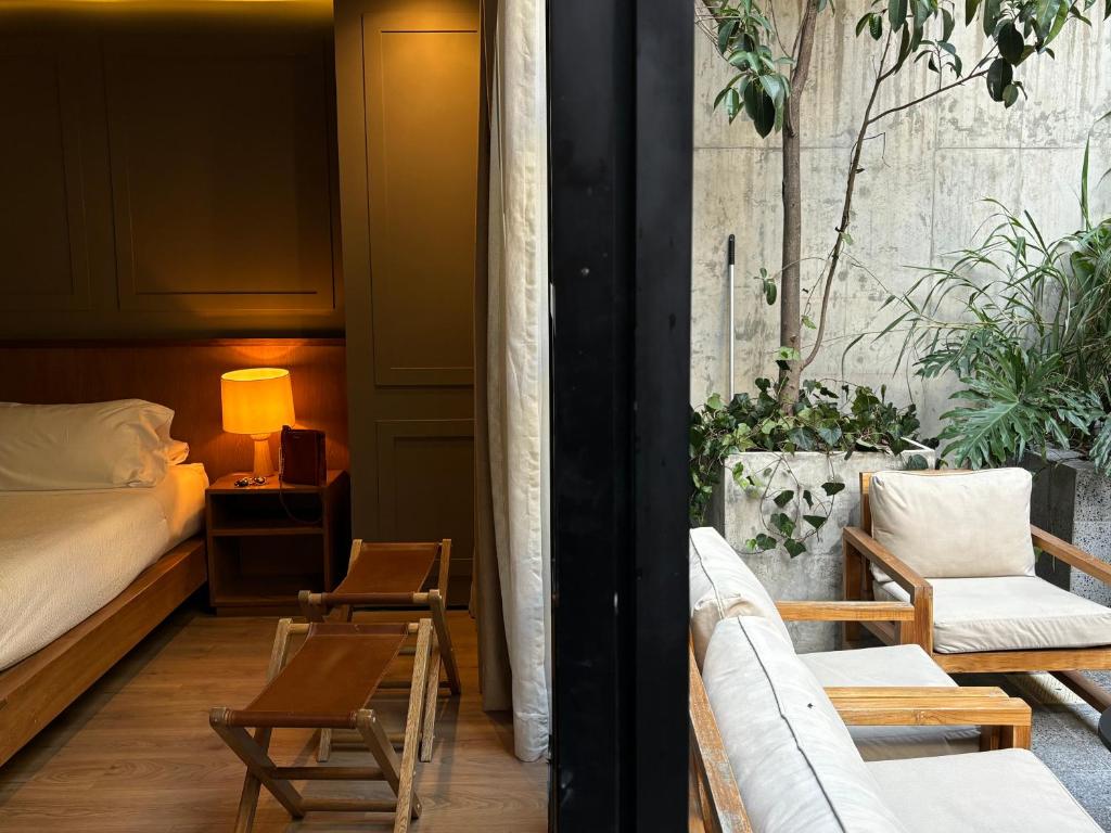 Postel nebo postele na pokoji v ubytování Hotel Coco