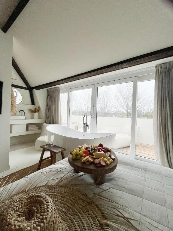 Ein Bett oder Betten in einem Zimmer der Unterkunft Het sfeerhuis aan zee