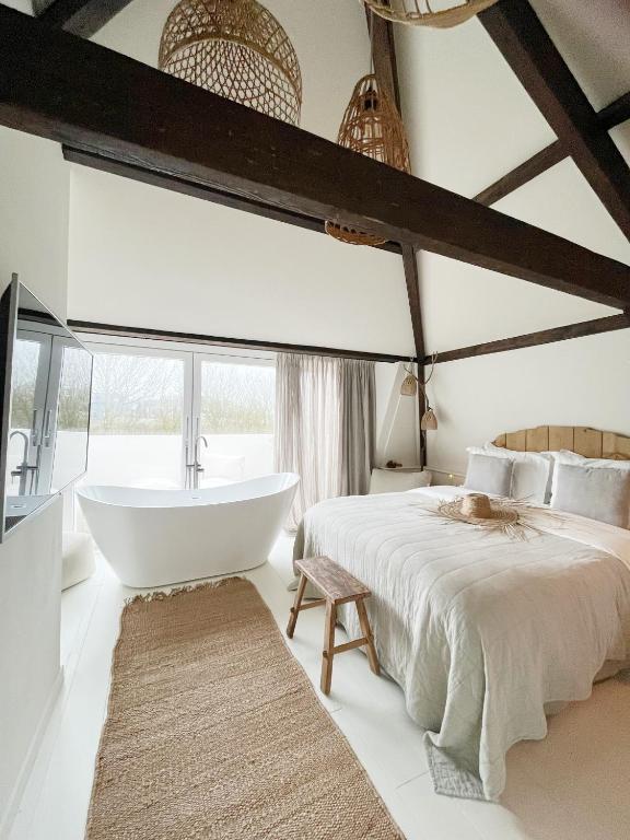 Ein Bett oder Betten in einem Zimmer der Unterkunft Het sfeerhuis aan zee
